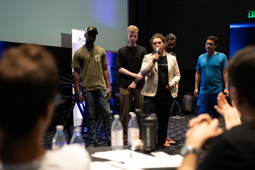 The Neo Sapiens team presenting on stage at Miami Hack Week 2024